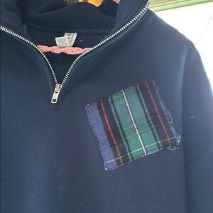 Blue quarter zip sweatshirt with flannel plaid patch